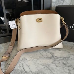 Off white Coach bag with double removable straps. Brand new with tags